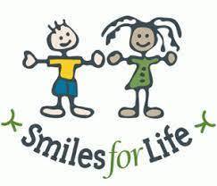 Clipart image of two students standing above the words "Smiles for Life"